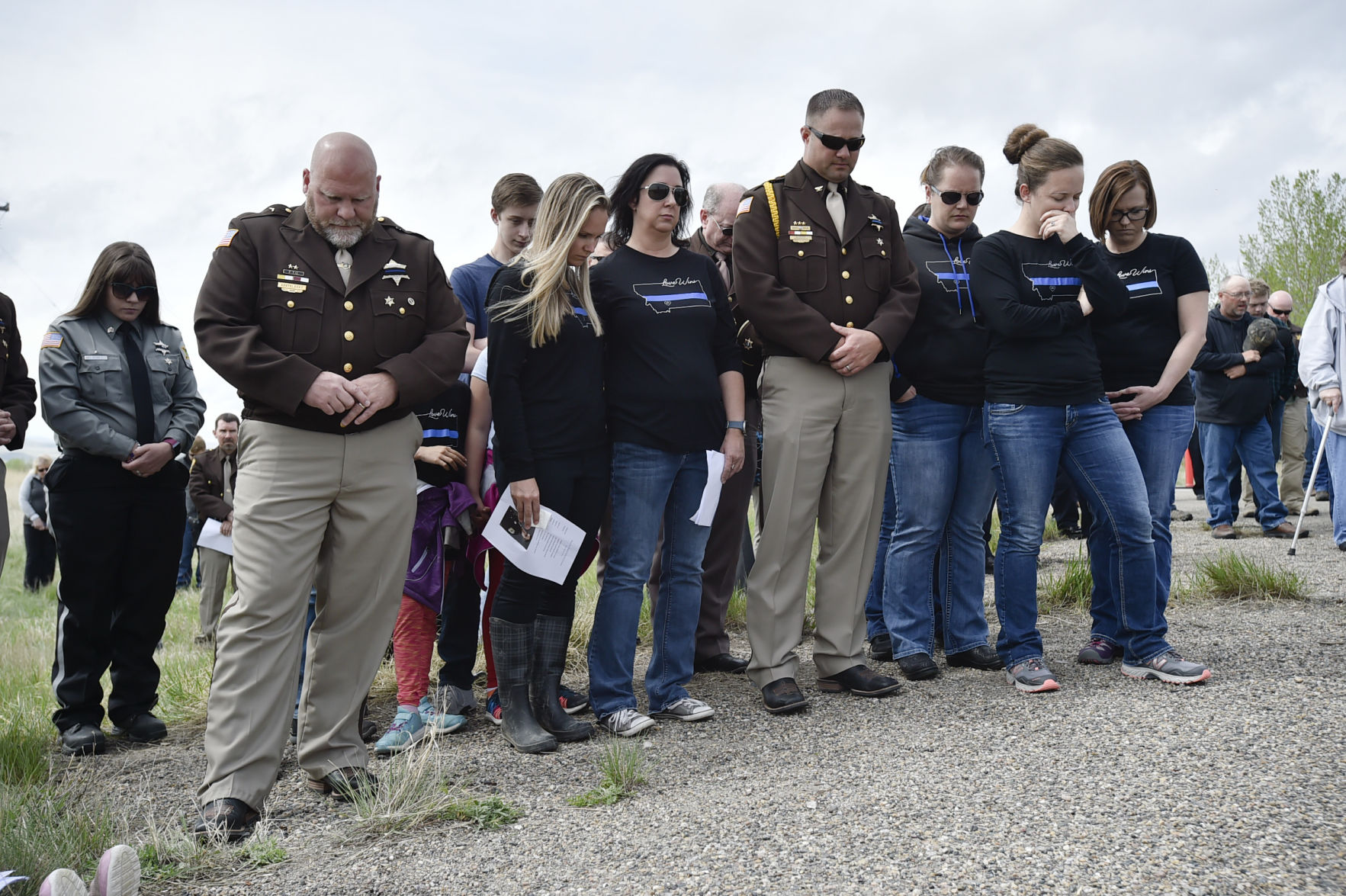 People gather on Highway 287